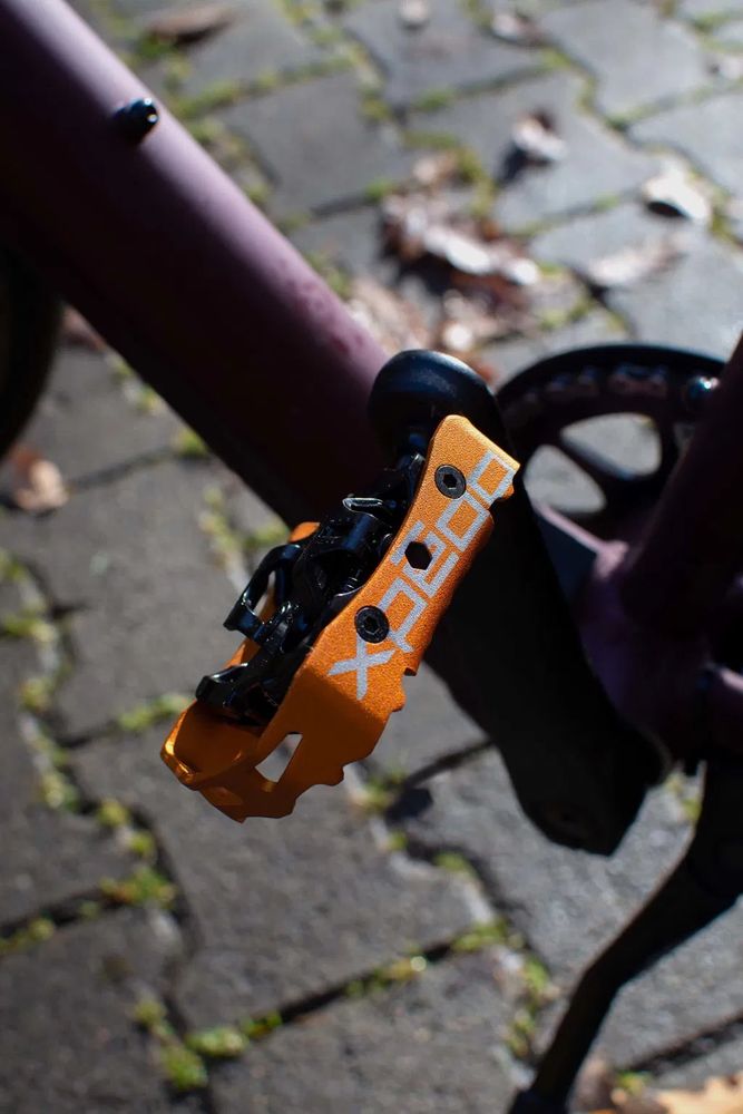 Xpedo Clipless Pedal Milo, schwarz/orange